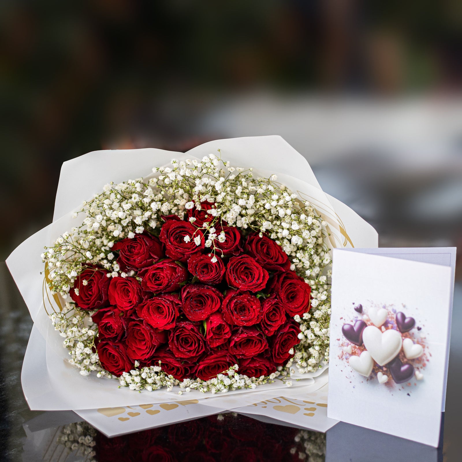 Bouquet of 25 red roses with baby's breath for Valentine's Day, hand-arranged by Luxe Gifts & Flowers in Nairobi